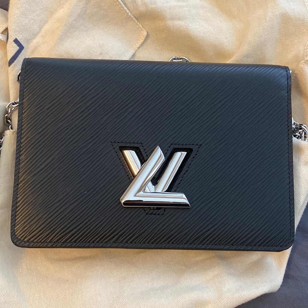 Louis Vuitton twist belt chain pouch. Black and silver hardware. Bnwt